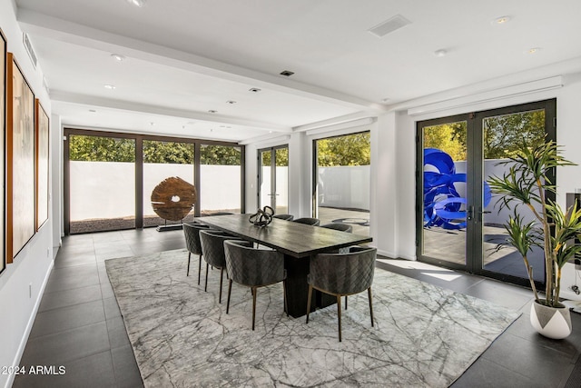 dining area featuring french doors and plenty of natural light