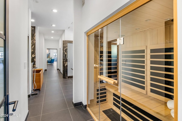 view of sauna with tile patterned floors, baseboards, and recessed lighting