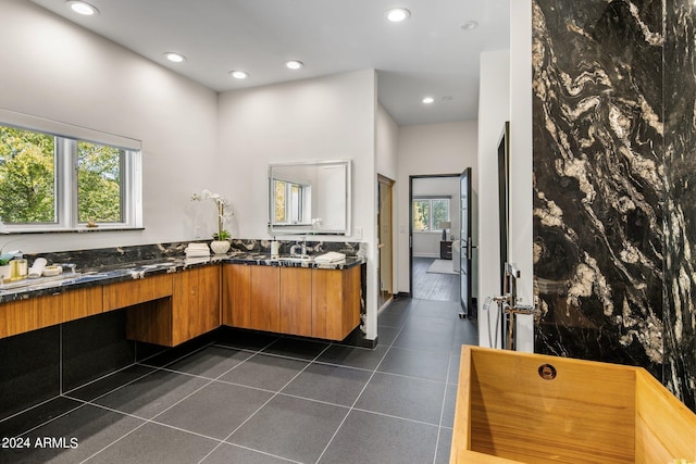 bathroom featuring vanity and a high ceiling