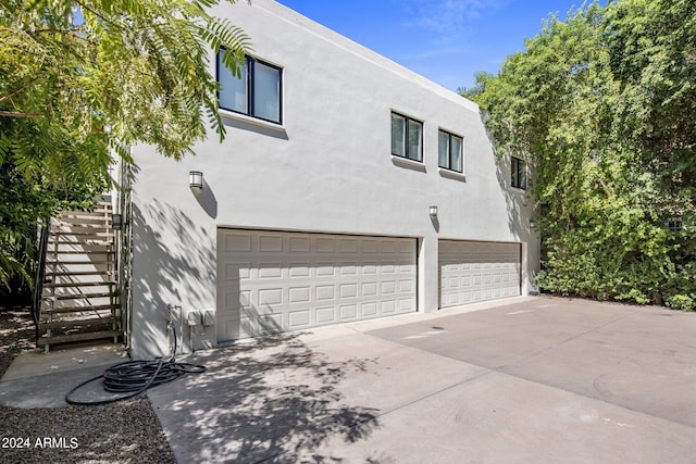 view of property exterior featuring a garage