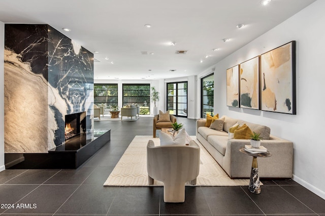 living room featuring a large fireplace