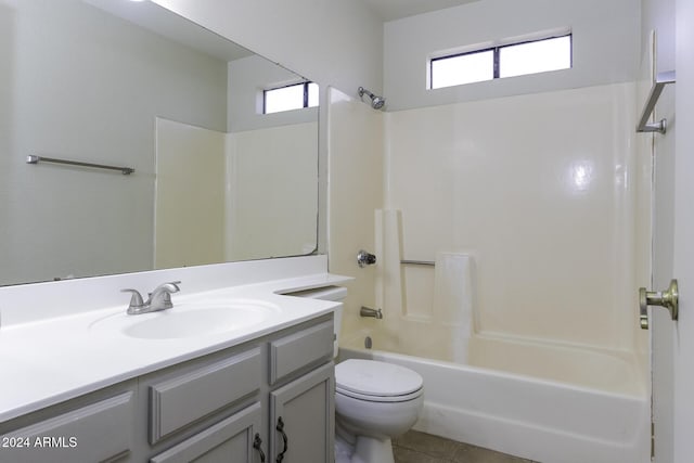 full bathroom with washtub / shower combination, tile patterned floors, vanity, and toilet