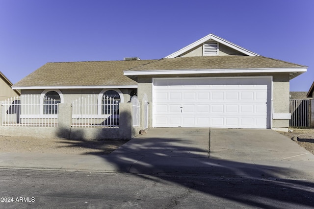 single story home with a garage