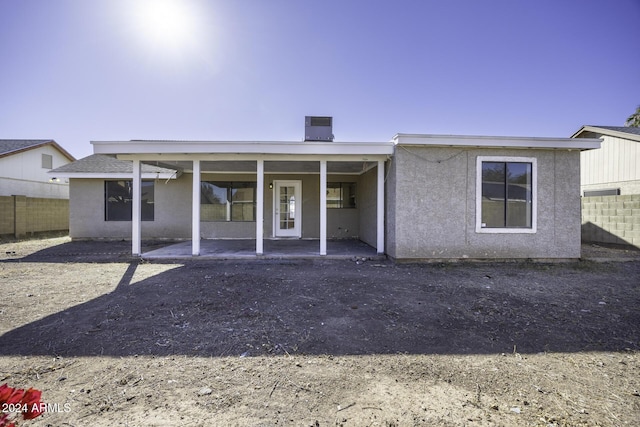 rear view of house featuring a patio