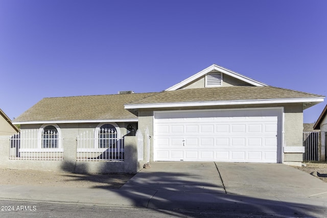 ranch-style house featuring a garage