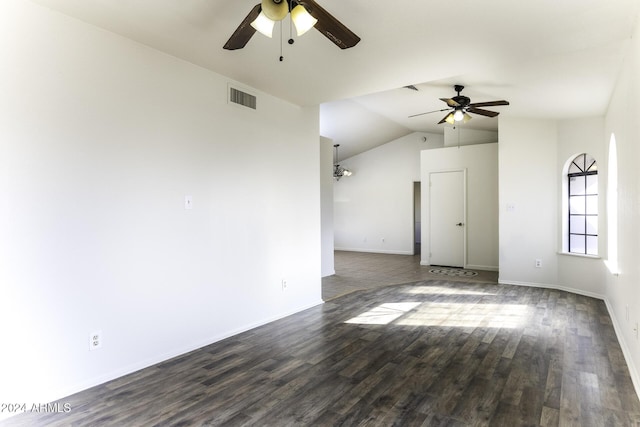 empty room with ceiling fan, dark hardwood / wood-style flooring, and vaulted ceiling