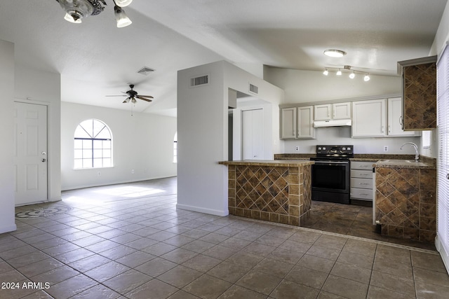 kitchen with lofted ceiling, white cabinets, tile patterned floors, black range with electric stovetop, and ceiling fan