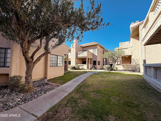 view of property's community with a lawn