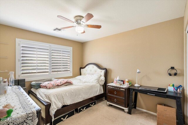 bedroom featuring ceiling fan and light colored carpet