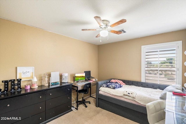 carpeted bedroom featuring ceiling fan