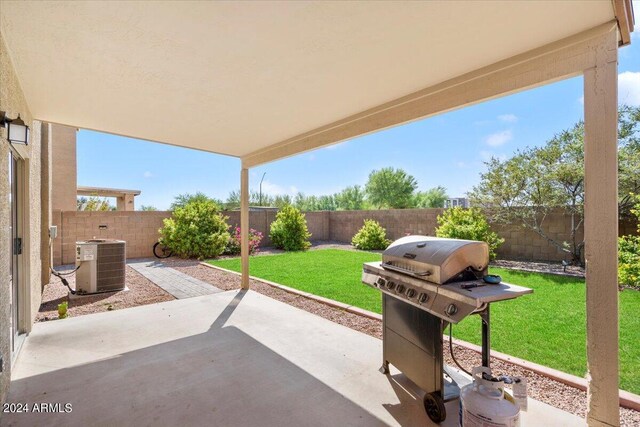 view of patio / terrace with area for grilling and central air condition unit