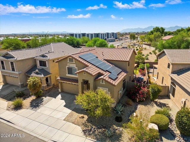 birds eye view of property with a mountain view