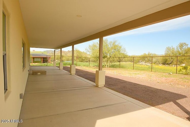 view of patio / terrace featuring fence