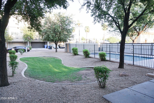 view of yard featuring a fenced in pool