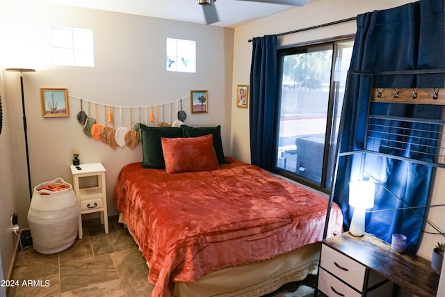 bedroom featuring ceiling fan and access to exterior