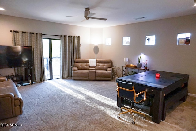 playroom with light carpet and ceiling fan