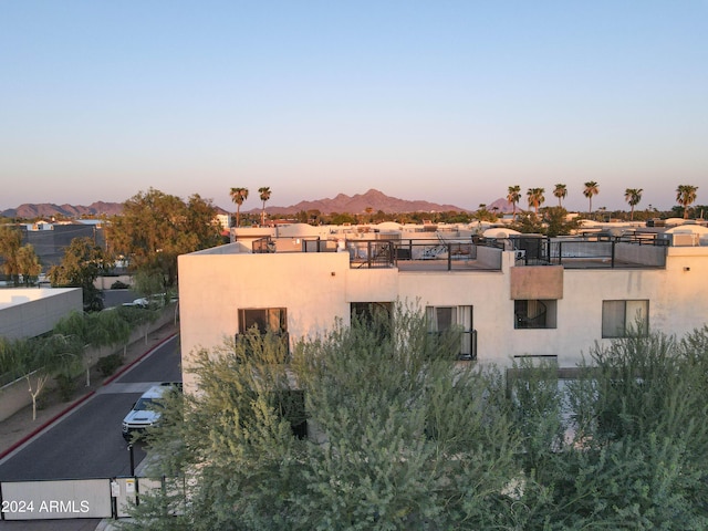 outdoor building at dusk featuring a mountain view