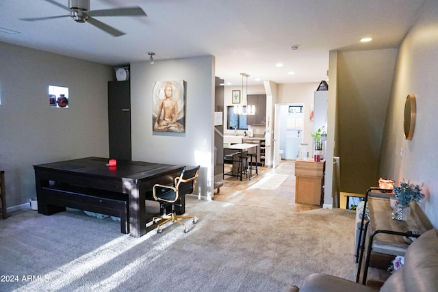 interior space with light carpet and ceiling fan