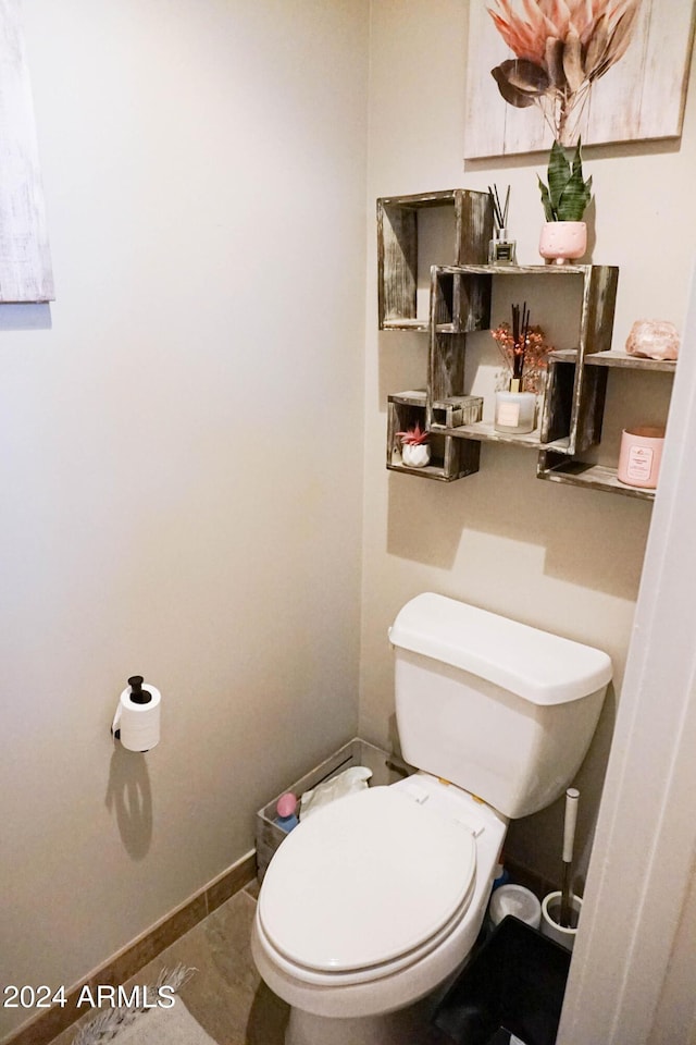 bathroom featuring tile patterned floors and toilet