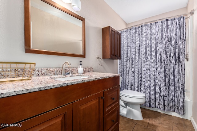 full bathroom featuring vanity, shower / tub combo, toilet, and tile patterned floors