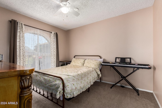 carpeted bedroom with a textured ceiling and ceiling fan