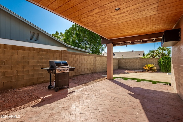 view of patio featuring a grill