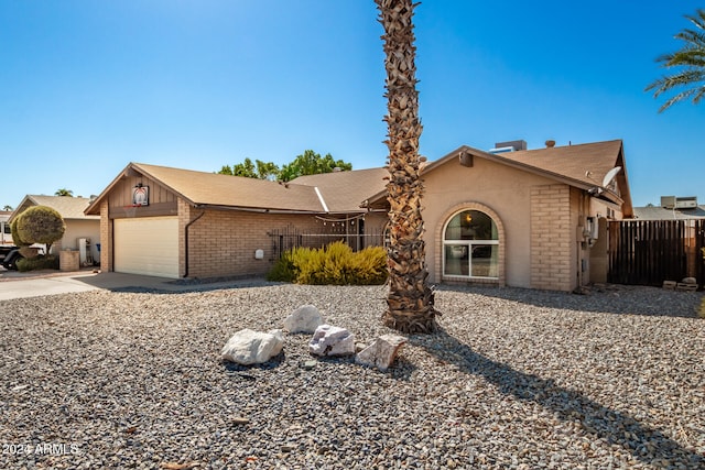 ranch-style house featuring a garage