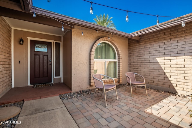 entrance to property with a patio