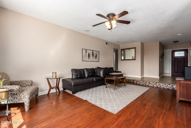 living room featuring ceiling fan and hardwood / wood-style floors