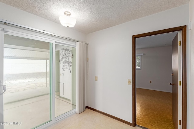 interior space featuring a textured ceiling