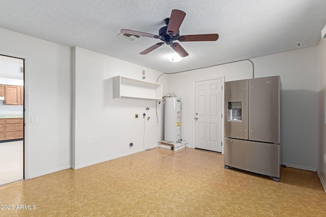 unfurnished living room featuring ceiling fan, water heater, and a textured ceiling