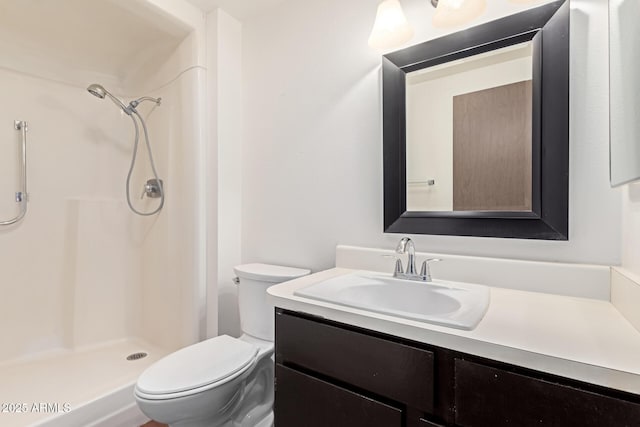 bathroom with vanity, toilet, and walk in shower