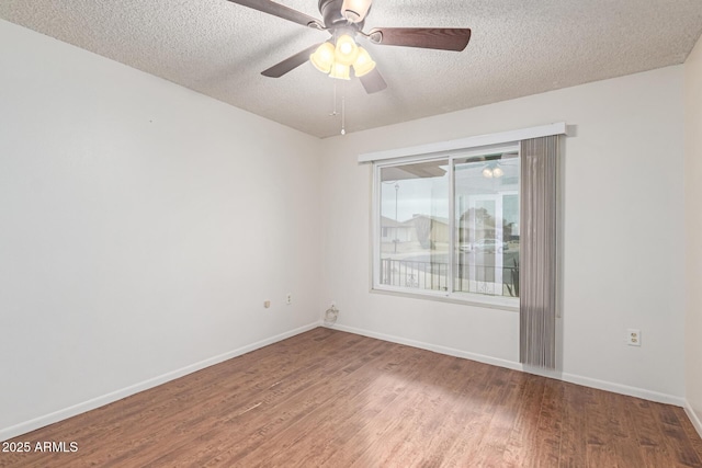 spare room with wood-type flooring, ceiling fan, and a textured ceiling