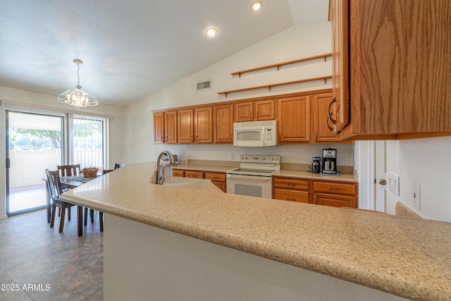 kitchen with sink, white appliances, high vaulted ceiling, decorative light fixtures, and kitchen peninsula