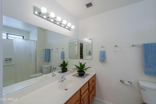 bathroom with vanity, a shower with curtain, and toilet