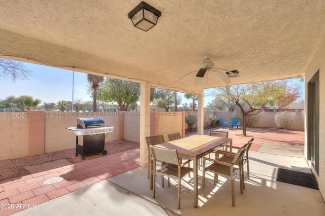 view of patio featuring ceiling fan and a grill