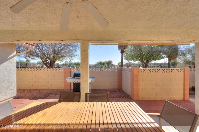 view of patio with ceiling fan and grilling area