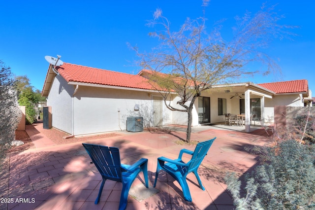 back of house featuring a patio area and ceiling fan