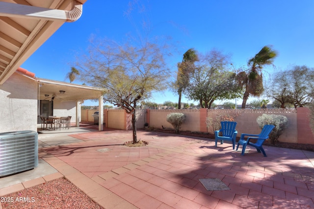 view of patio / terrace with ceiling fan and central AC unit