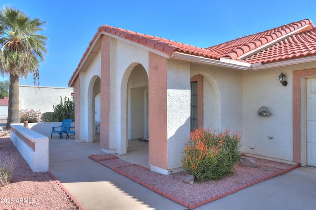 doorway to property featuring a patio area