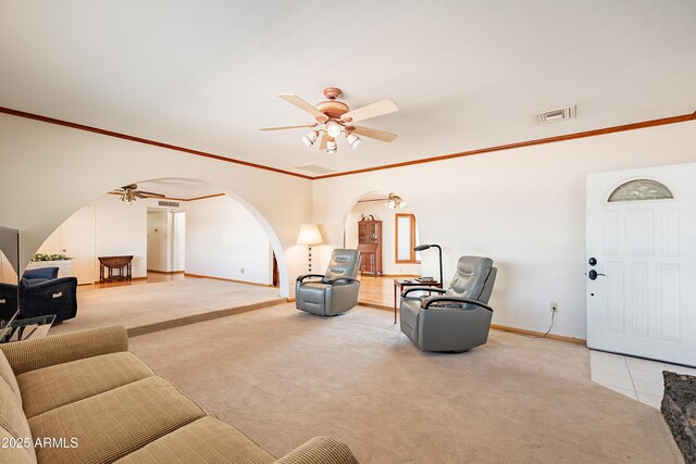 3109 N 81st St, Scottsdale, AZ 85251 - carpeted living area with ceiling fan, arched walkways, baseboards, and crown molding