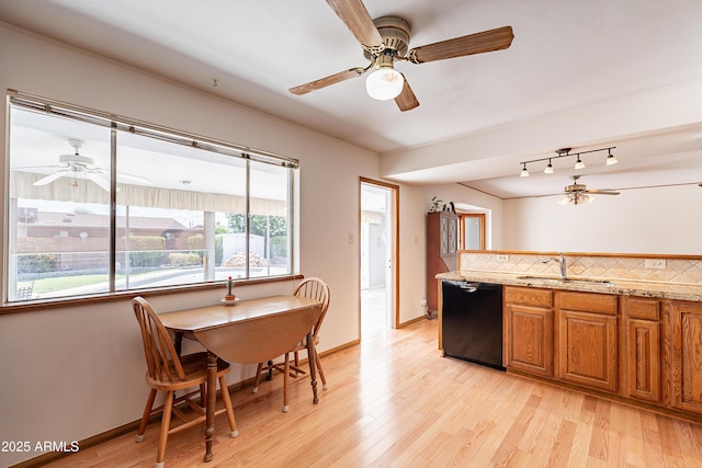 3109 N 81st St, Scottsdale, AZ 85251 - kitchen with dishwasher, a sink, a ceiling fan, brown cabinets, and light wood finished floors