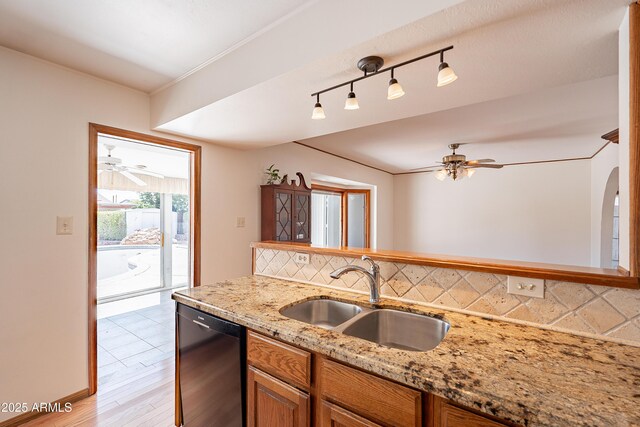 3109 N 81st St, Scottsdale, AZ 85251 - kitchen with a sink, dishwasher, ceiling fan, decorative backsplash, and light stone counters