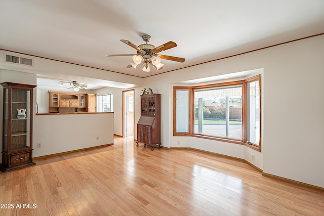 3109 N 81st St, Scottsdale, AZ 85251 - unfurnished living room featuring ceiling fan, baseboards, and light wood finished floors