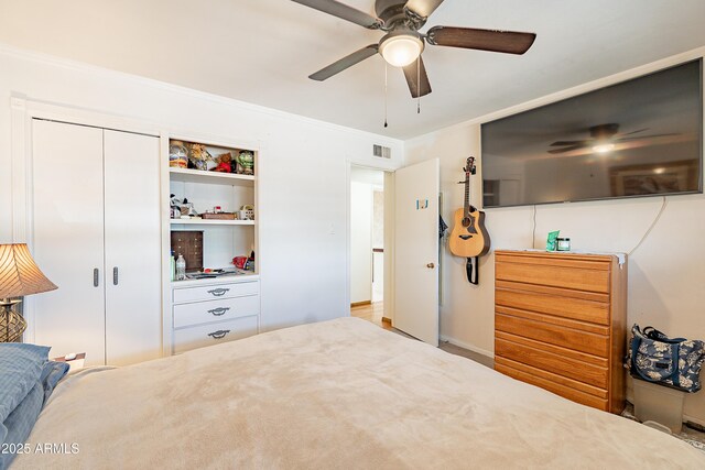 3109 N 81st St, Scottsdale, AZ 85251 - bedroom featuring crown molding, ceiling fan, and a closet