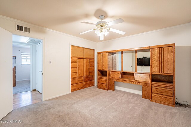 3109 N 81st St, Scottsdale, AZ 85251 - unfurnished bedroom with light colored carpet, crown molding, a closet, ceiling fan, and baseboards