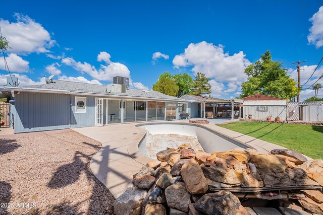3109 N 81st St, Scottsdale, AZ 85251 - back of property with a patio, central AC unit, and a chimney