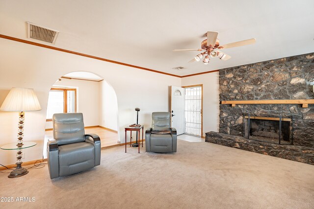 3109 N 81st St, Scottsdale, AZ 85251 - carpeted living room with arched walkways, ceiling fan, plenty of natural light, baseboards, and crown molding