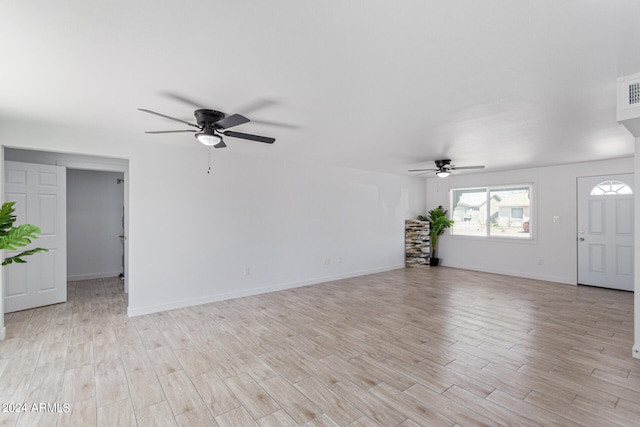 unfurnished living room with ceiling fan and light hardwood / wood-style flooring