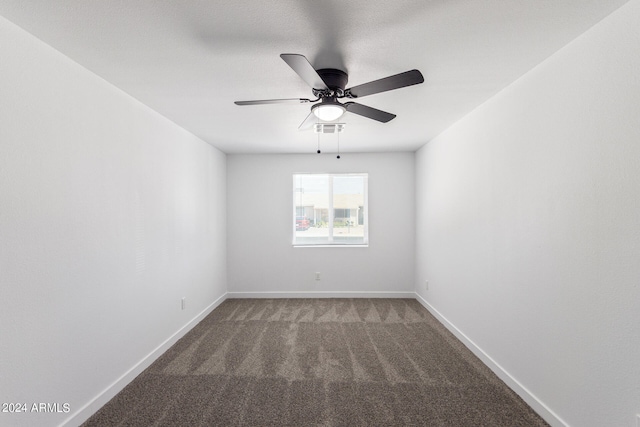 unfurnished room with carpet flooring and ceiling fan